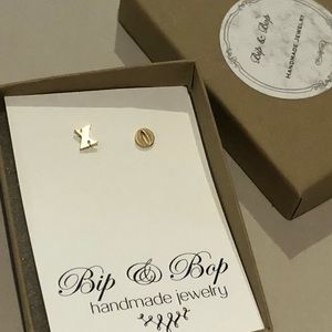 Gold “XO” stud earrings. New in box.